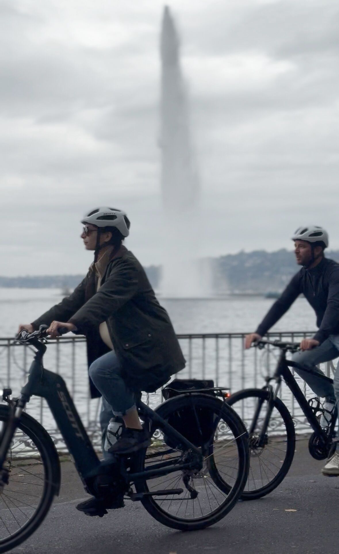 Cycling along Lake Geneva in front of the Jet d'Eau